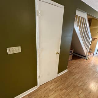 Emptied room and closed door after a cleanout