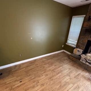 Empty room with wood floors after a cleanout